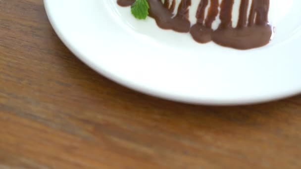 close-up footage of delicious pudding with chocolate pour on table - Footage, Video