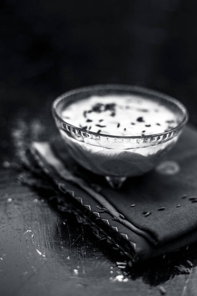 Raw yogurt with cumin seeds on napkin - Фото, изображение