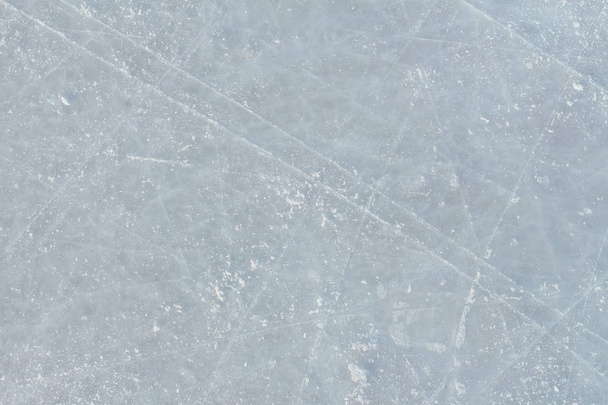 De achtergrond van het ijs met merken van hockey en schaatsen. IJshockey ijsbaan krassen oppervlak - Foto, afbeelding