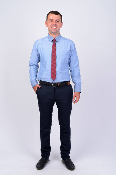 Full body shot of happy businessman smiling and laughing - Photo, image