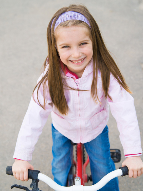 little girl with her bicycle - 写真・画像