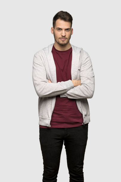 Man with sweatshirt portrait over grey background - Foto, afbeelding