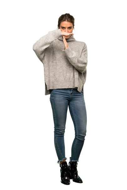 A full-length shot of a Blonde woman with turtleneck making time out gesture over isolated white background - Foto, Bild