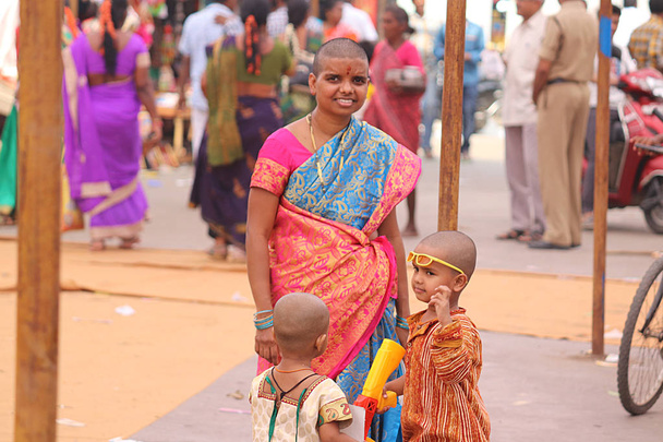 Mother and children in market in Bhadrachalam city, India - Photo, Image
