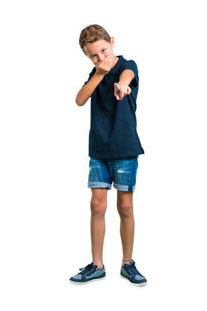 Full body of Little boy pointing with finger at someone and laughing a lot on white background - Fotografie, Obrázek