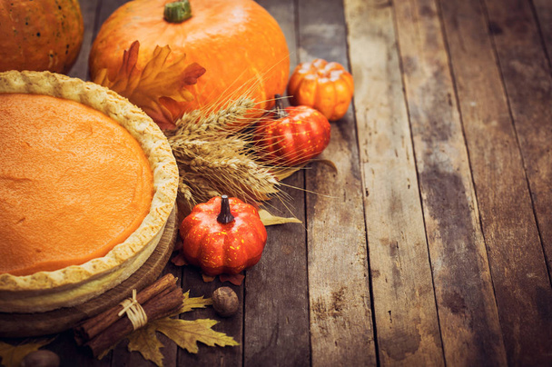 close up view of homemade pumpkin pie on wooden background - Фото, зображення