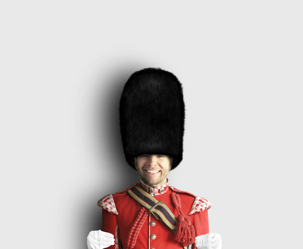 Young man in the costume of the Royal guards of Britain - Φωτογραφία, εικόνα