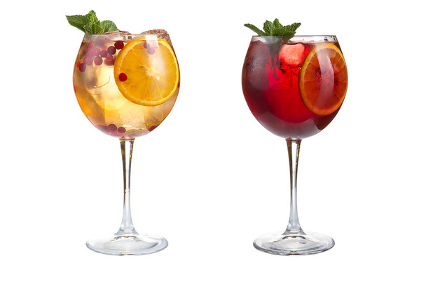 Two summer cocktails with mint, fruits and berries on a white background. Cocktails in glass goblets. Isolated. - Foto, Imagen