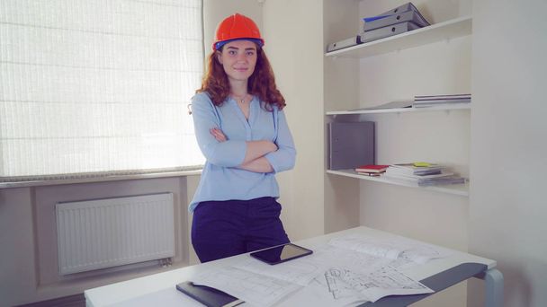 Woman architect with blueprint architectural plan. - Fotó, kép