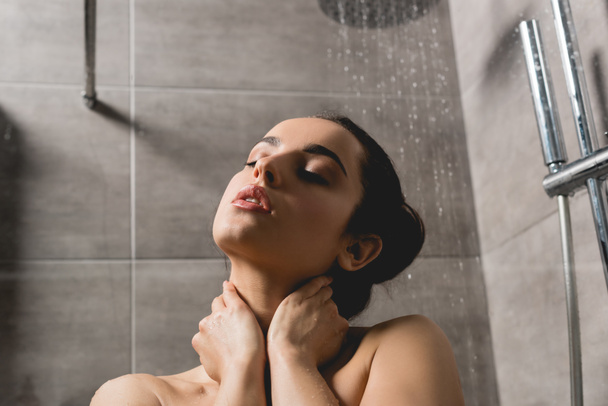 beautiful naked woman taking shower in cabin  - Zdjęcie, obraz