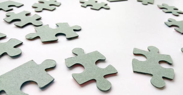 Abstract grey jigsaw puzzle pieces on white background. Symbol of teamwork, network and business strategy, canvas template photography with copy space - Photo, Image