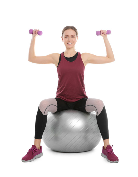 Young woman doing sports exercises isolated on white. Home fitness - Fotografie, Obrázek