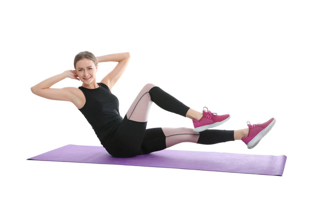 Young woman doing sports exercises isolated on white. Home fitness - Фото, зображення
