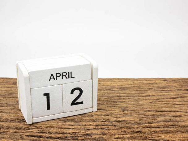April 12 white wooden calendar on vintage wood and white background with Spring day, Copyspace for text. - Fotografie, Obrázek