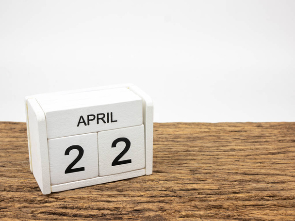 April 22 white wooden calendar on vintage wood and white background with Spring day, Copyspace for text, World Earth day concept. - Foto, imagen