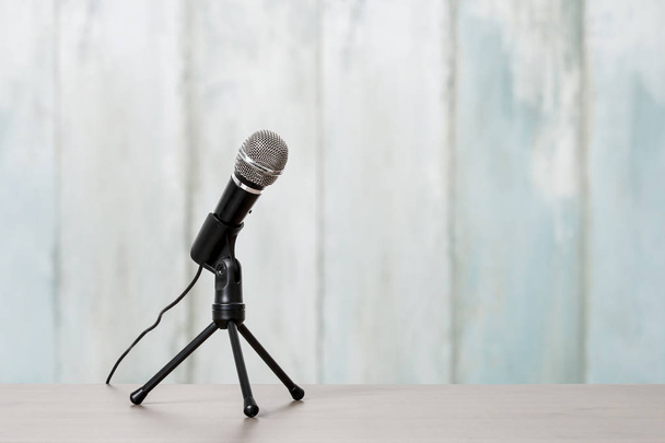 Microphone isolated on blue wooden background. Graphic resources - Фото, изображение