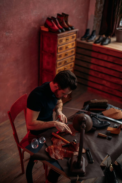 talented shoemaker mending shoes of the client - Fotó, kép