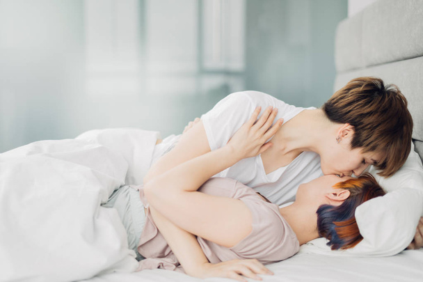 lesbians life, homosexual women spending time in the bed - Fotó, kép