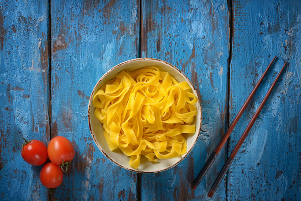Pasta with Tomatoes on old table - Foto, imagen