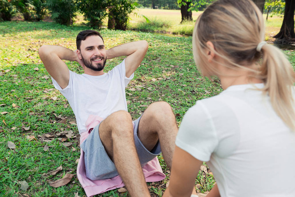 Young couple excercise in the park - Foto, Bild