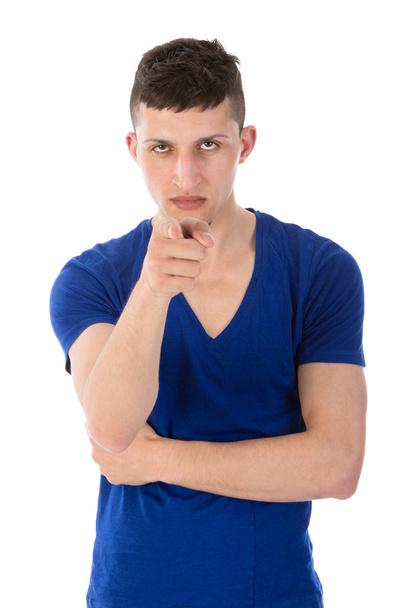 Angry young man pointing a finger towards you, isolated on white - Photo, Image