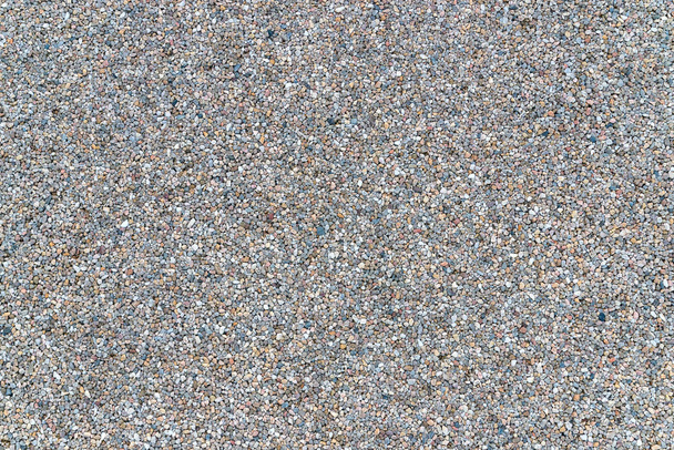 White granite gravel stones flooring pattern surface texture. Close-up of exterior natural material for design decoration background. - Photo, Image