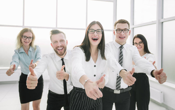 happy business team showing their thumbs up - 写真・画像