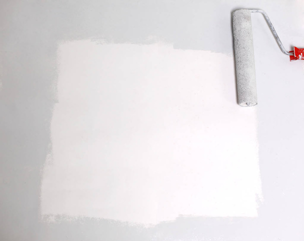 square painted white with the paint roller, on a white sheet of - Photo, image