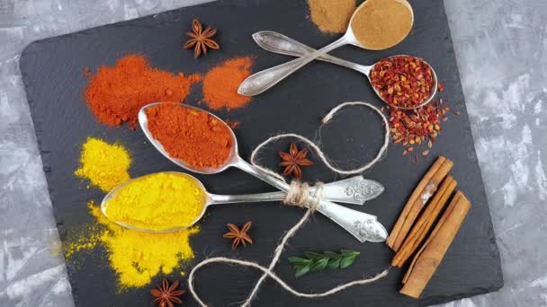 Spices and seasonings for cooking in the composition on the table - Footage, Video
