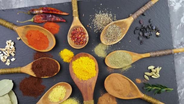 Spices and seasonings for cooking in the composition on the table - Footage, Video