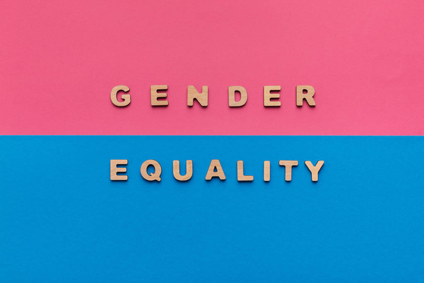 Gender equality words on pink and blue background - Photo, Image