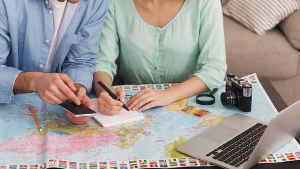 Couple planning vacation trip and searching information - Photo, Image