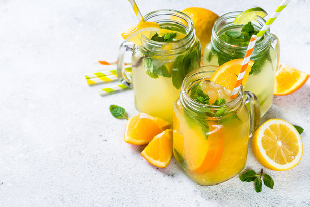 Lemonade, mojito and orange lemonade on white. - Фото, изображение