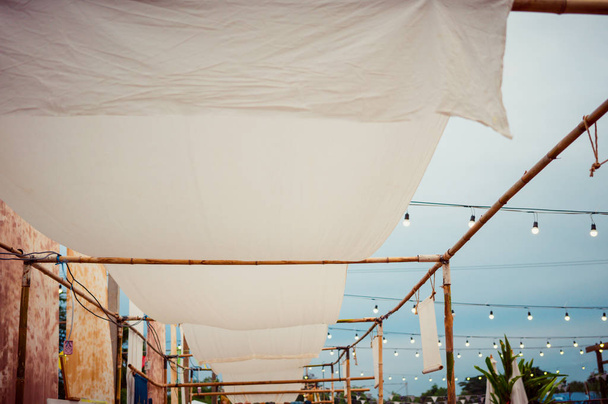 Handmade thai Cotton hanging on bamboo railing in the market. - Photo, Image