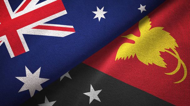 Αυστραλία και Νέα Παπούα-Γουϊνέα διπλωμένα δύο σημαίες μαζί - Φωτογραφία, εικόνα
