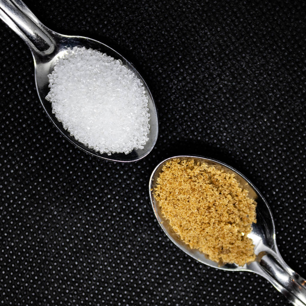 Two spoons with white and brown sugar - Photo, Image
