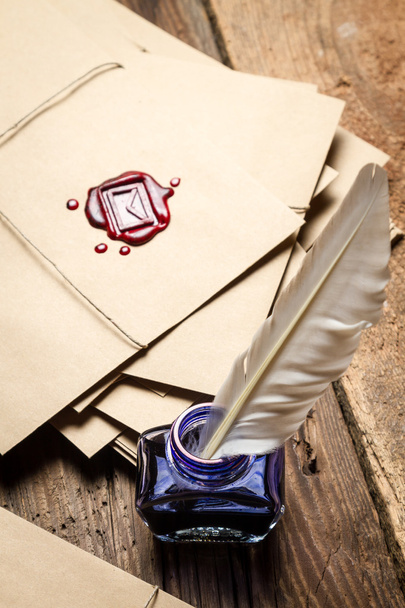Ancient scrolls and old envelope with blue inkwell - Foto, afbeelding
