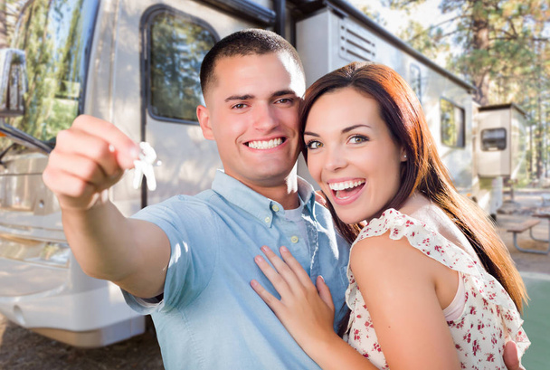Young Military Couple Holding Keys In Front of New RV. - Φωτογραφία, εικόνα