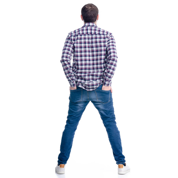 A man in jeans hands in pocket standing - Photo, Image