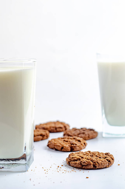 chocolate chip cookies and glass of milk on white background - Foto, Imagem