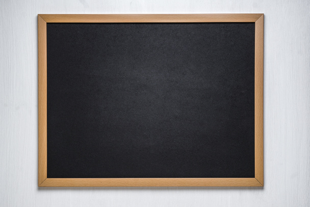 chalk board on a white wooden background - Photo, image
