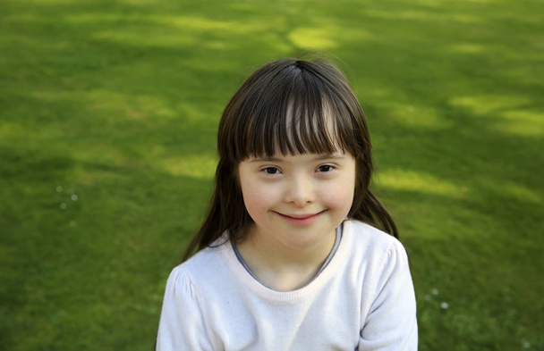 Portrait of little girl smiling outside - Photo, Image
