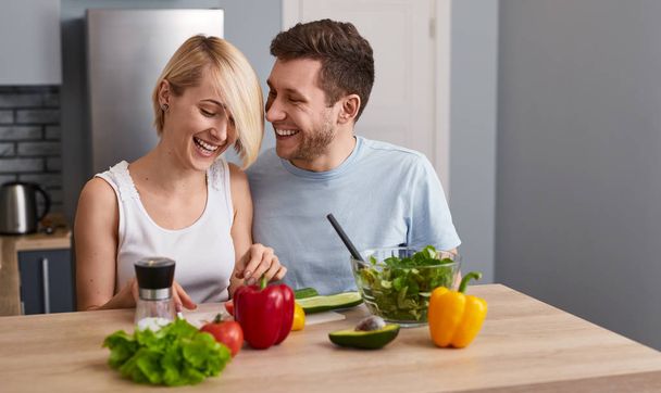 Romantic couple making healthy salad  - Zdjęcie, obraz