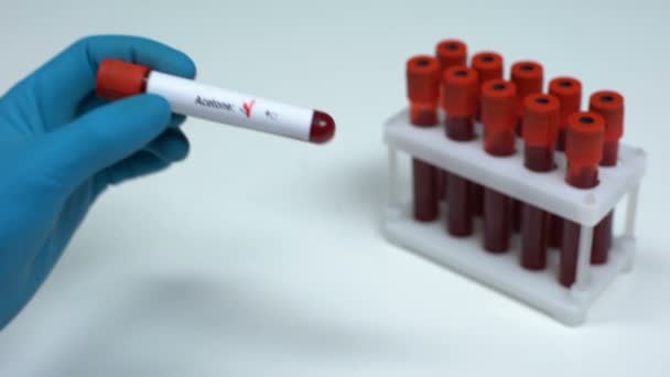 Negative acetone test, doctor showing blood sample, lab research health check-up - Filmagem, Vídeo
