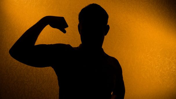 Strength and health - silhouette of man - Zdjęcie, obraz