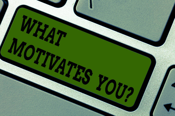 Text sign showing What Motivates You. Conceptual photo provide someone with reason for doing something Keyboard key Intention to create computer message pressing keypad idea. - Photo, Image