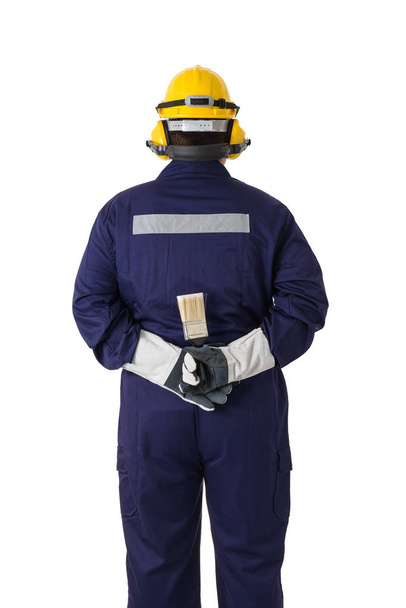back view portrait of a worker in Mechanic Jumpsuit is holding a paint brush with helmet, earmuffs, Protective gloves and Safety goggles isolated on white background clipping path - Φωτογραφία, εικόνα