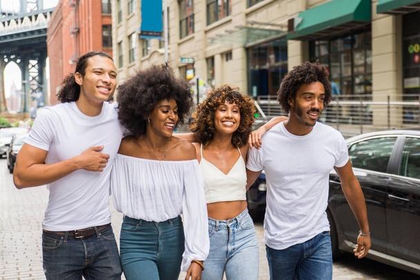 Group of afroamerican friends bonding in Manhattan, New York - Young adults having fun outdoors, concepts about lifestyle and young adult generation - Fotó, kép