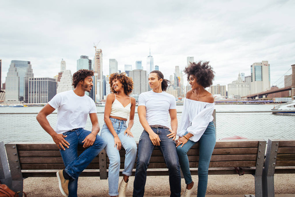 Group of afroamerican friends bonding in Manhattan, New York - Young adults having fun outdoors, concepts about lifestyle and young adult generation - Φωτογραφία, εικόνα
