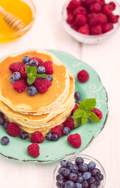 homemade pancakes with fresh berries on wooden background - Φωτογραφία, εικόνα